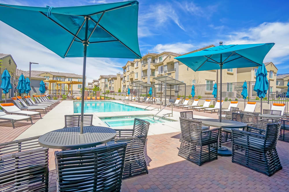 Shaded seating near the pool at Olympus Northpoint in Albuquerque, New Mexico