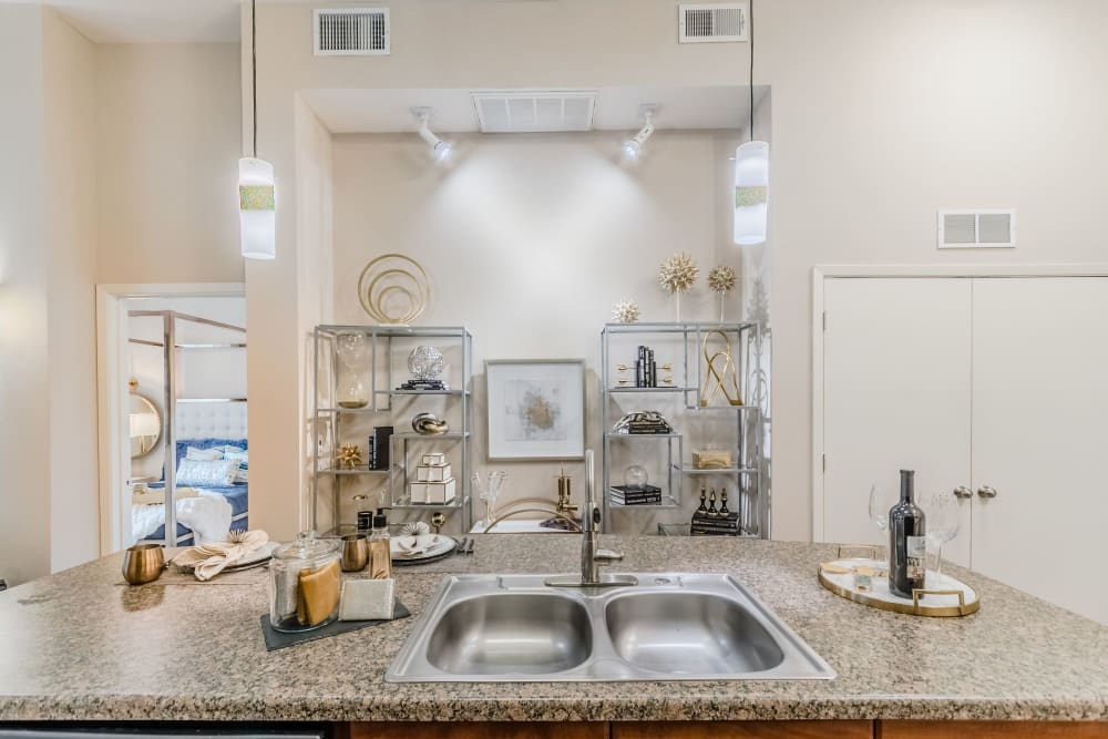 Kitchen island in apartment at Olympus Boulevard in Frisco, Texas