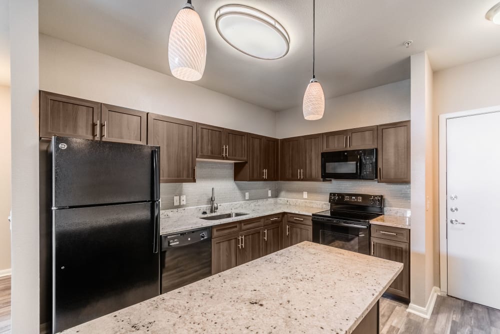 Well-lighted kitchen at Olympus Boulevard in Frisco, Texas