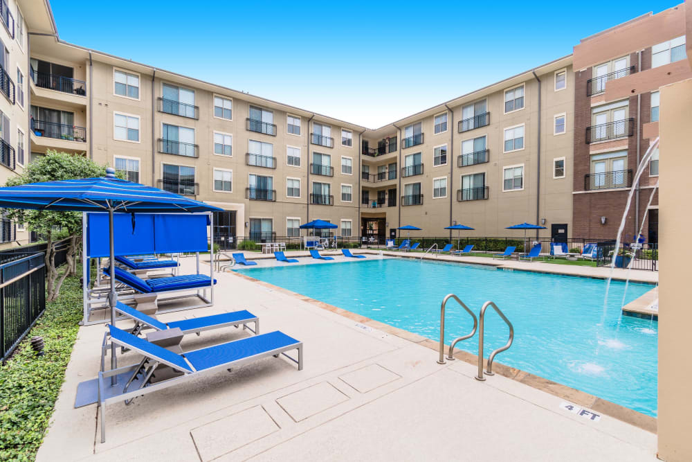 Recliner chairs at the pool at Olympus Boulevard in Frisco, Texas