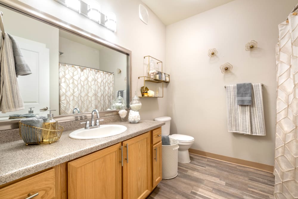 Spacious bathroom with a quartz countertop in a model home at Olympus Solaire in Albuquerque, New Mexico