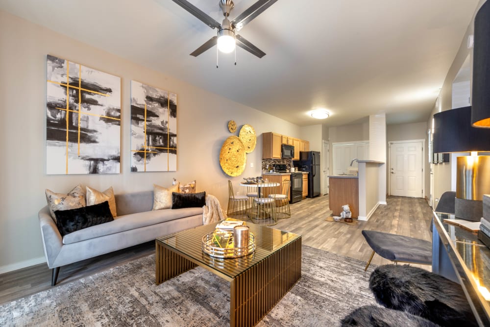 Ceiling fan and hardwood floors in the living space of a model apartment at Olympus Solaire in Albuquerque, New Mexico