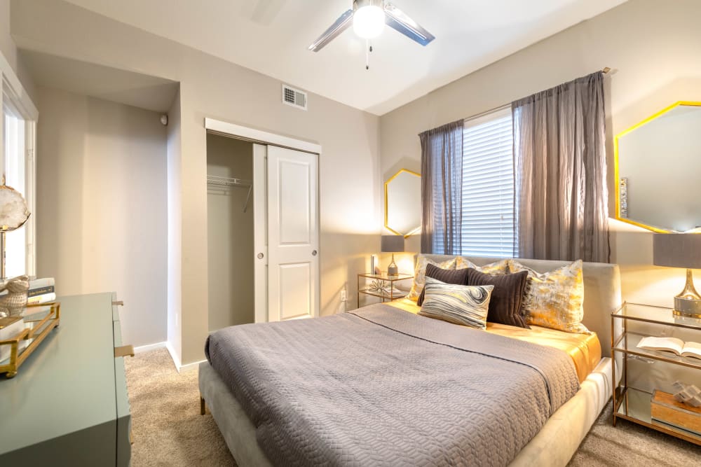 Well-furnished master bedroom in a model apartment at Olympus Solaire in Albuquerque, New Mexico