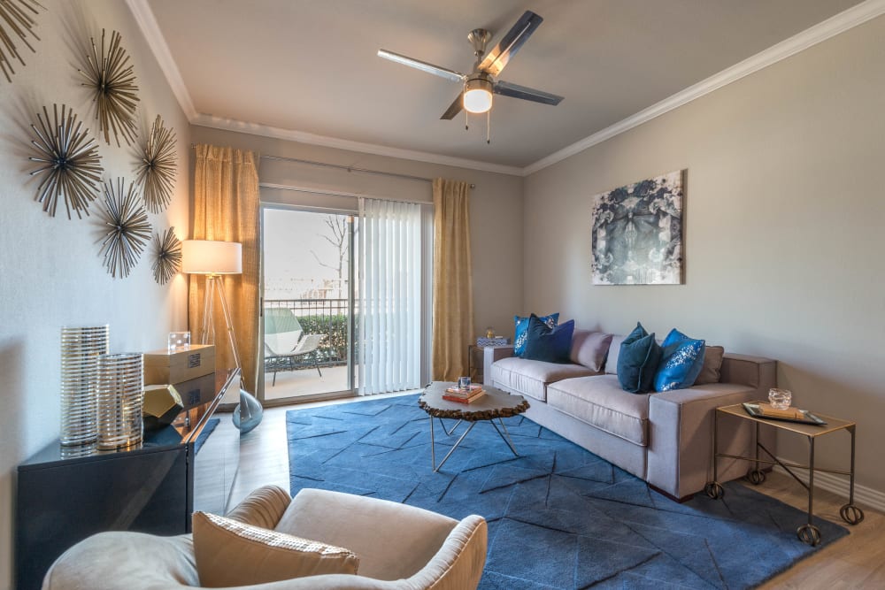 Classic decor in the living space of a model home at Olympus Stone Glen in Keller, Texas