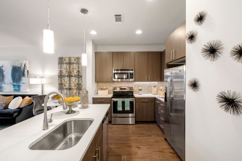 Kitchen in model apartment at Olympus Grand Crossing in Katy, Texas