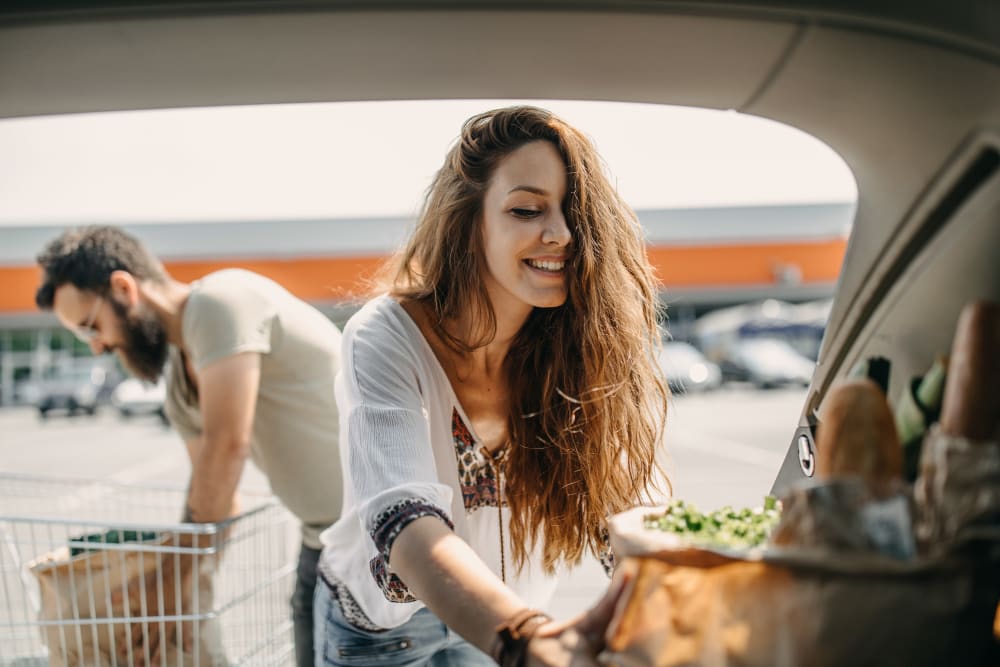 Residents loading groceries in their car near Milano in Portland, Oregon