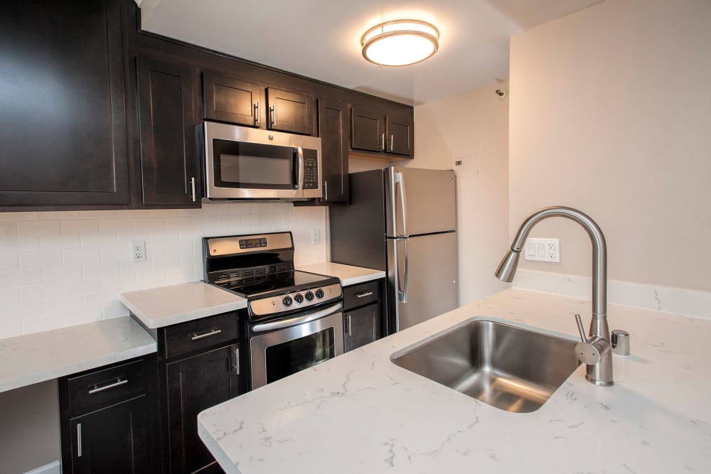 Kitchen with a breakfast bar at Tower 737 Condominium Rentals in San Francisco, California