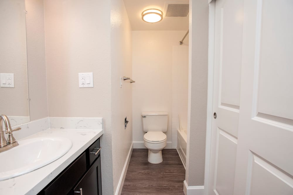 Spacious bathroom with a vanity mirror and oval tub at Tower 737 Condominium Rentals in San Francisco, California