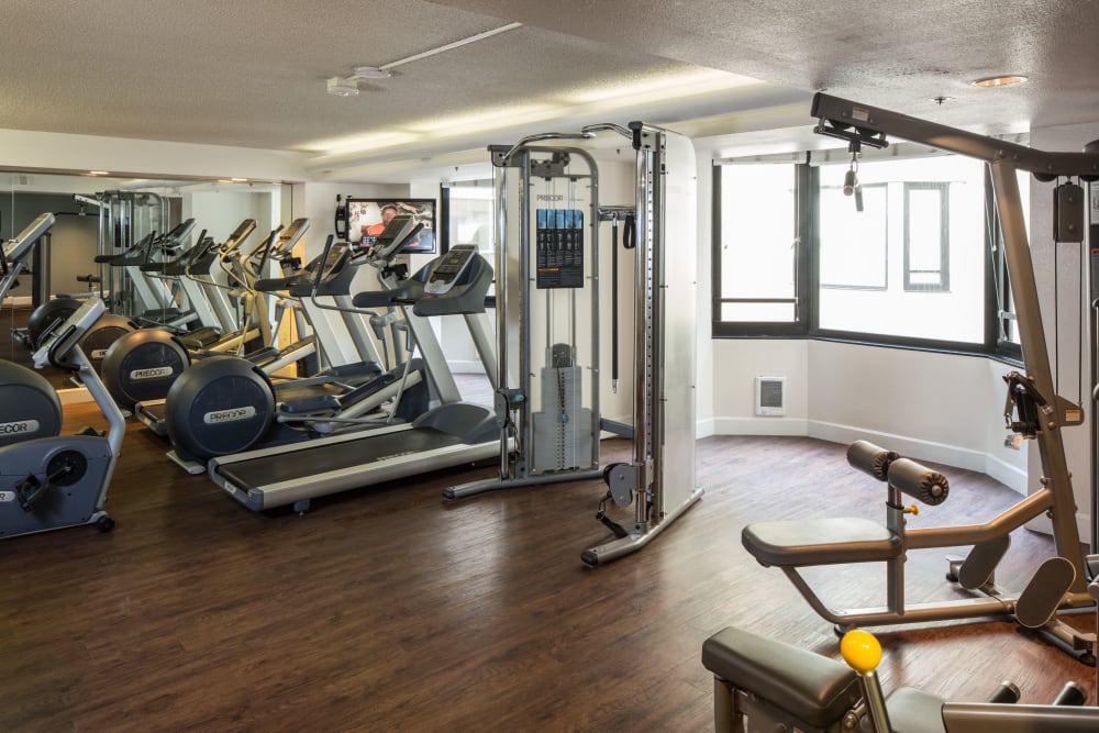 Spacious fitness center with plenty of workout stations at Tower 737 Condominium Rentals in San Francisco, California