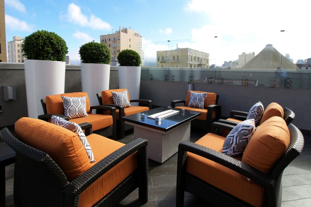Lounge chairs around a gas-fueled fire pit at Tower 737 Condominium Rentals in San Francisco, California