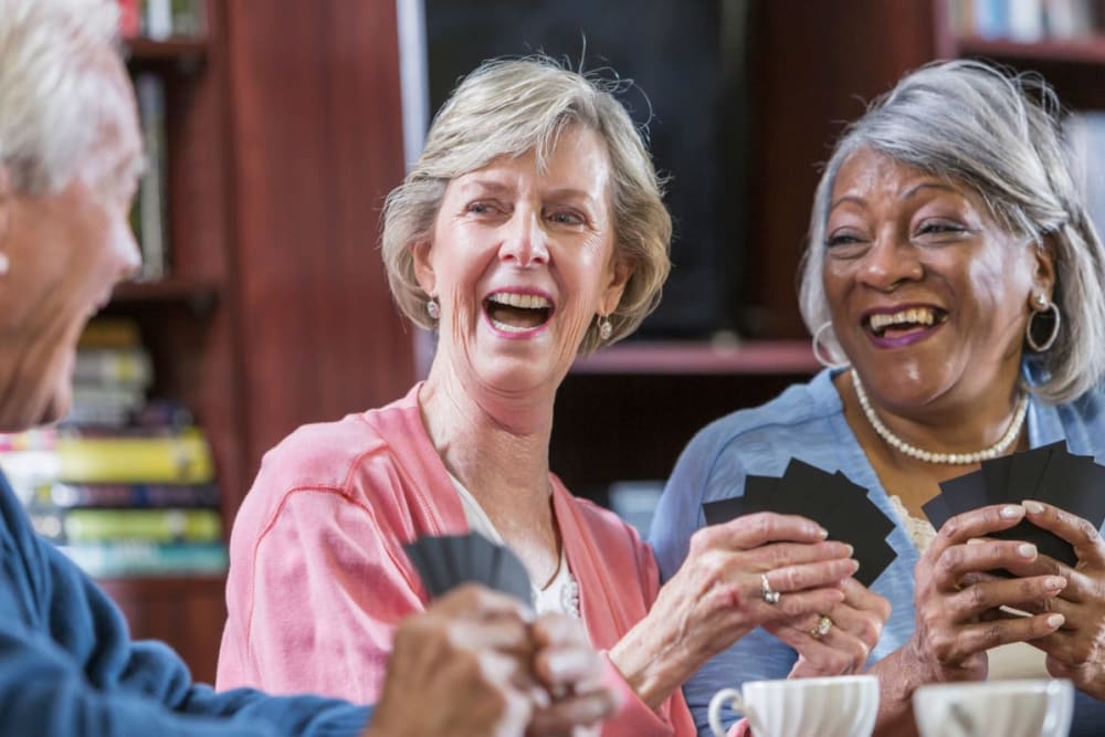 Residents playing a card game at Milestone Senior Living Stoughton in Stoughton, Wisconsin.