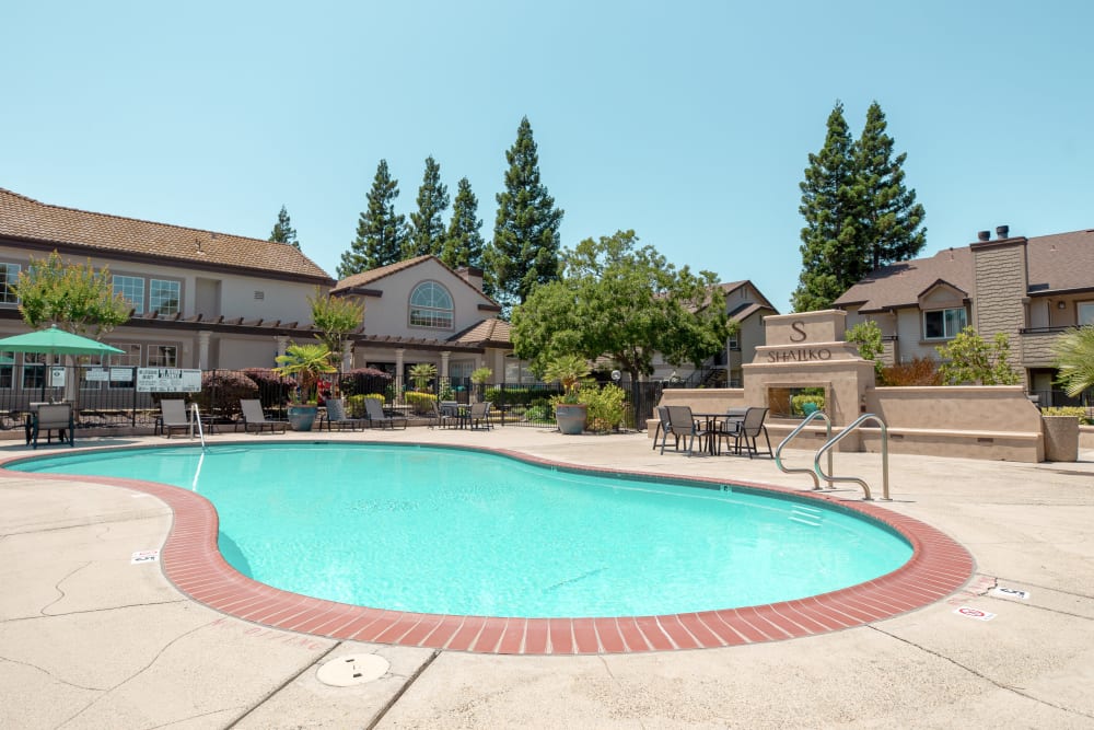 Swimming pool with a large sundeck for summer days at Shaliko in Rocklin, California