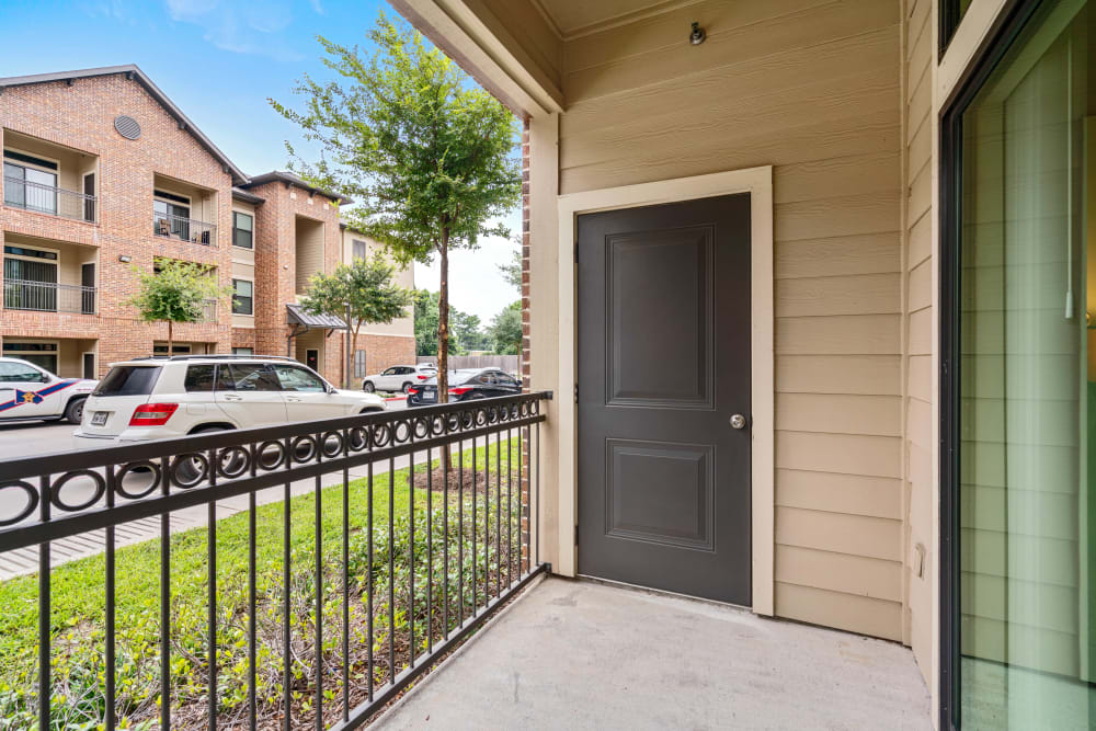 Private patio outside a model home at Olympus Sierra Pines in The Woodlands, Texas