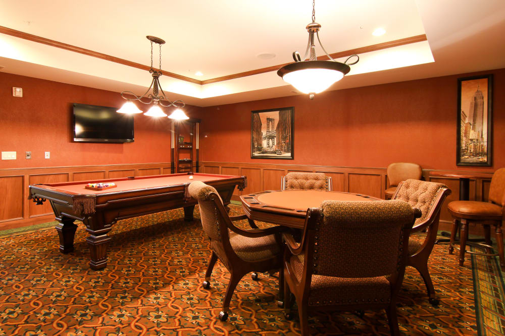 Resident game room with a pool table at Applewood Pointe of Roseville at Langton Lake in Roseville, Minnesota. 