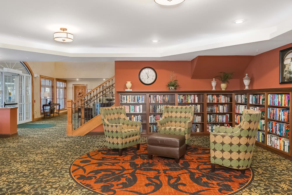 Library with seating area at Applewood Pointe of Shoreview in Shoreview, Minnesota. 