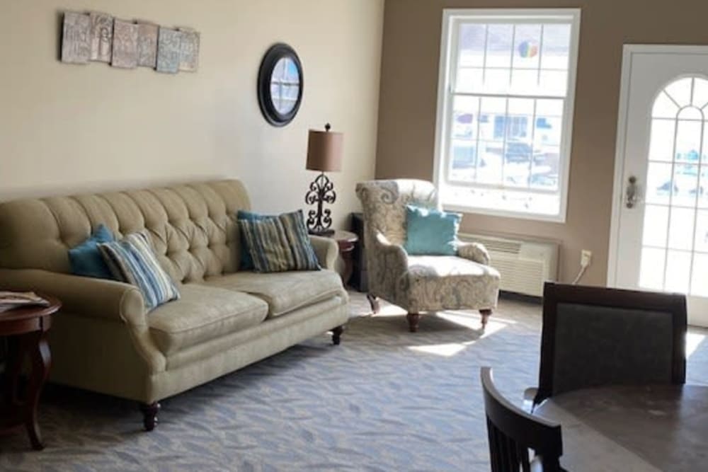 Elegant living area with wall art at Liberty Court in Dixon, Illinois. 