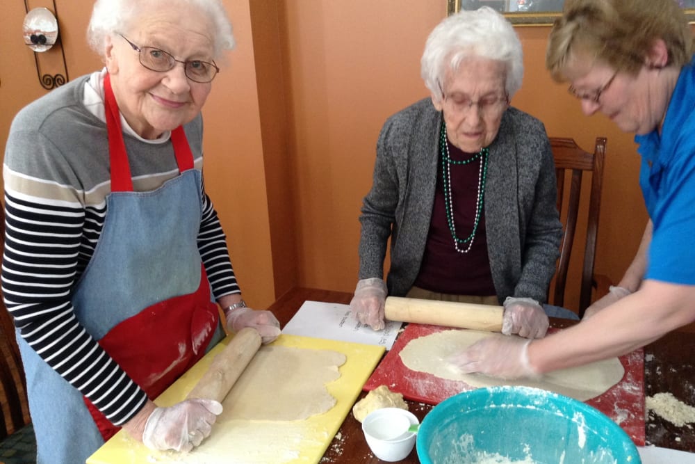 Resident baking group rolling cookie dough at Clover Ridge Place in Maquoketa, Iowa.