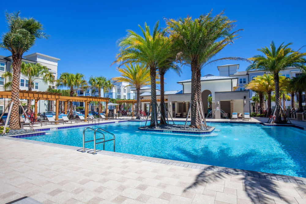 Sparkling swimming pool with palm trees at Linden Audubon Park in Orlando, Florida
