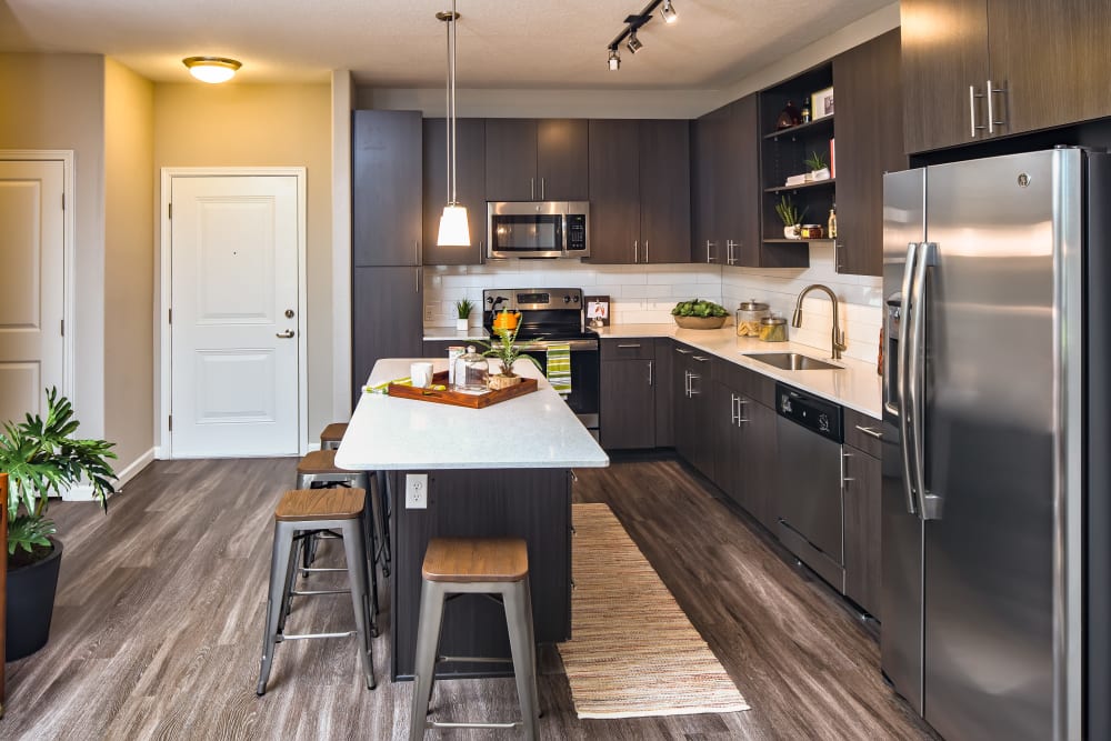 Kitchen with wood style flooring at Linden Audubon Park in Orlando, Florida