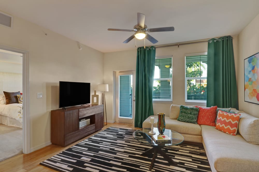 Living room with a ceiling fan at Linden Pointe in Pompano Beach, Florida