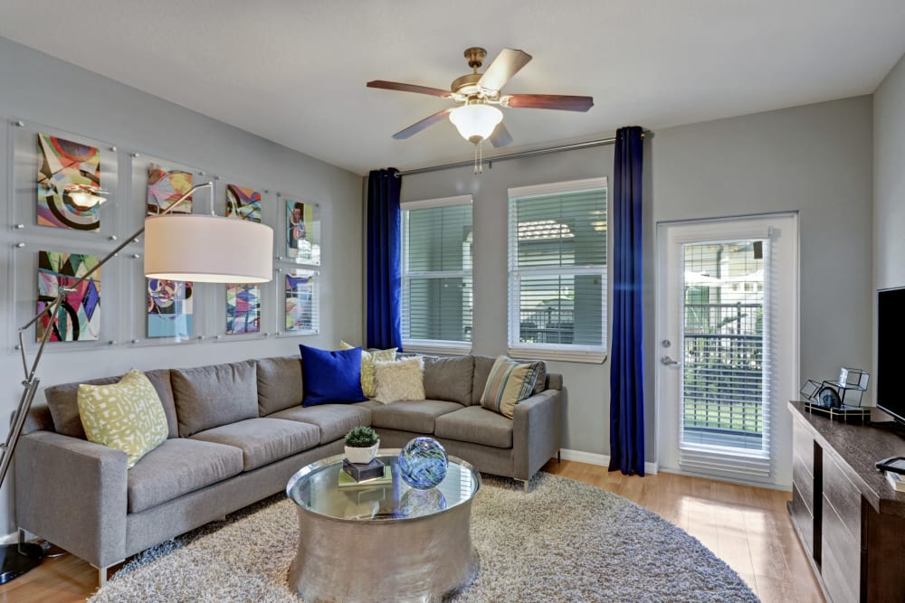 Spacious living room with patio access at Linden Pointe in Pompano Beach, Florida