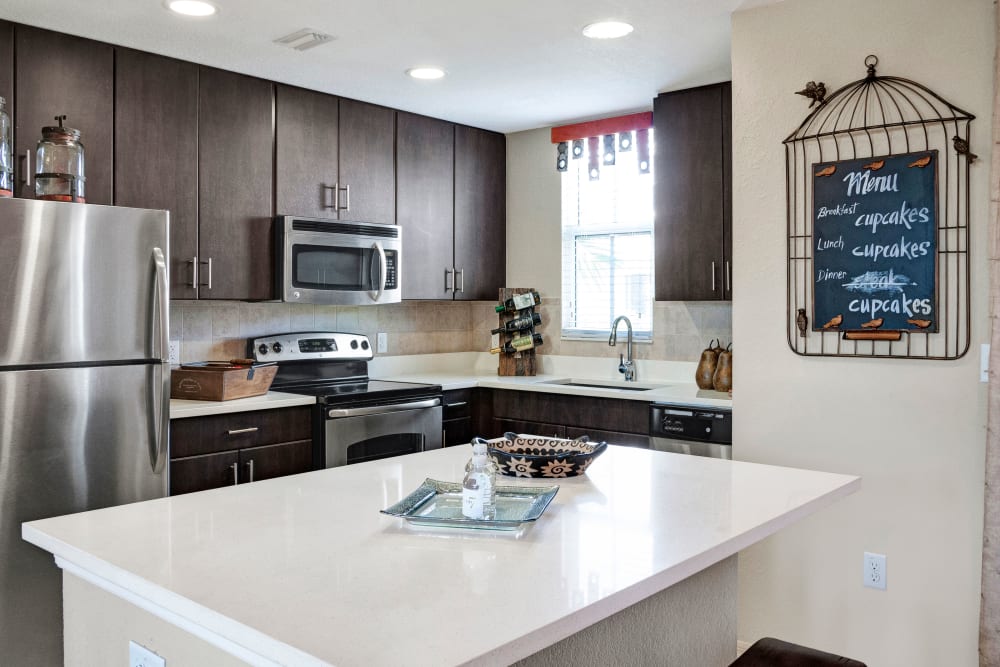 Kitchen with stainless steel appliances at City Center on 7th Apartment Homes in Pembroke Pines, Florida