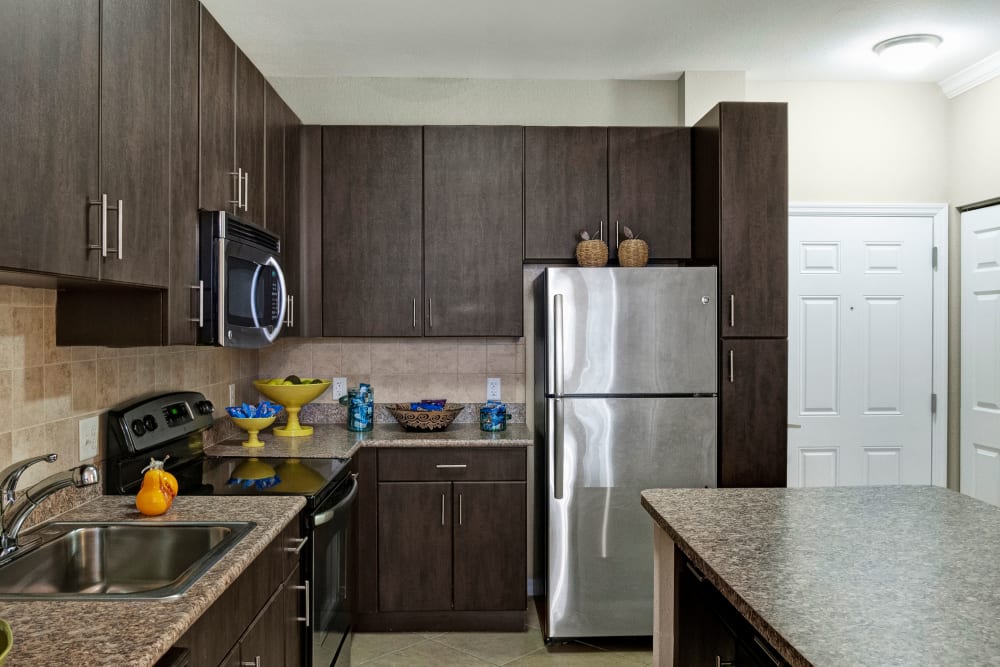 Kitchen with a kitchen island at City Center on 7th Apartment Homes in Pembroke Pines, Florida