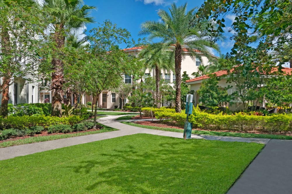 A walkway between apartment buildings at lCity Center on 7th Apartment Homes in Pembroke Pines, Florida