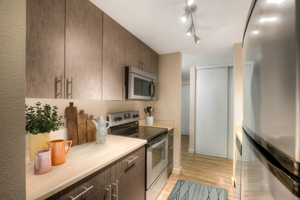 A kitchen with plenty of cabinet space at Karbon Apartments in Newcastle, Washington