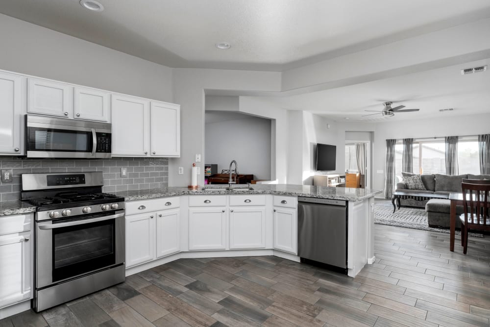 Open-concept kitchen in a model home at El Potrero Apartments in Bakersfield, California