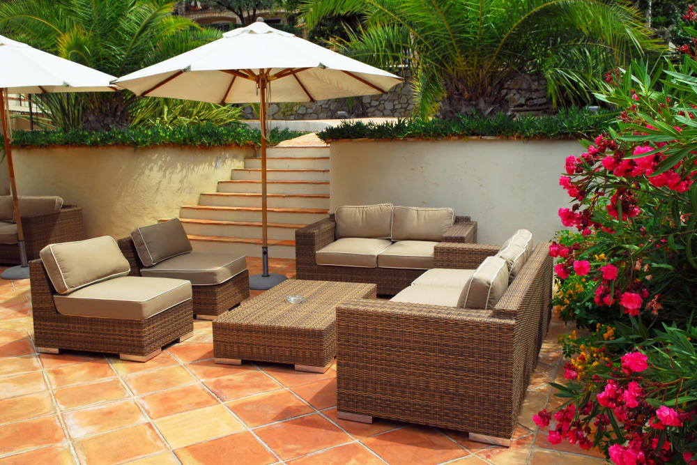 Shaded seating at an outdoor lounge area at Highland View Court in Bakersfield, California
