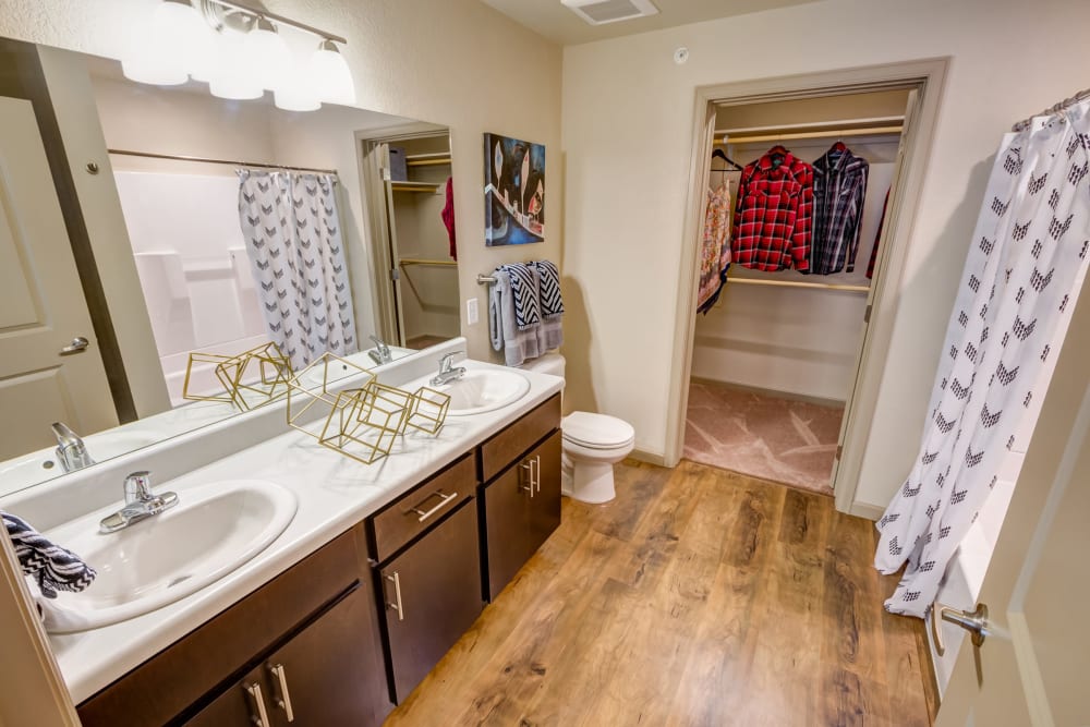 Hardwood flooring in a model apartment's bathroom at Granite 550 in Casper, Wyoming