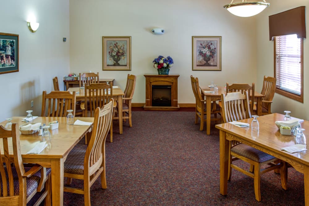 Small dining room with fireplace at Prairie Hills in Clinton, Iowa.