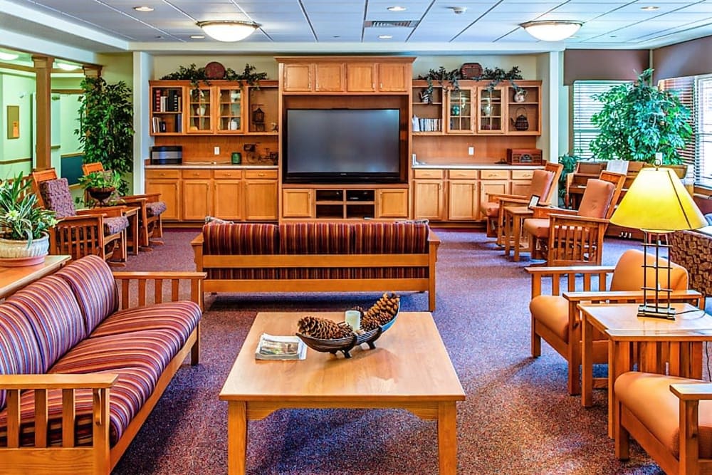Resident lounge with big screen TV at Prairie Hills in Clinton, Iowa.