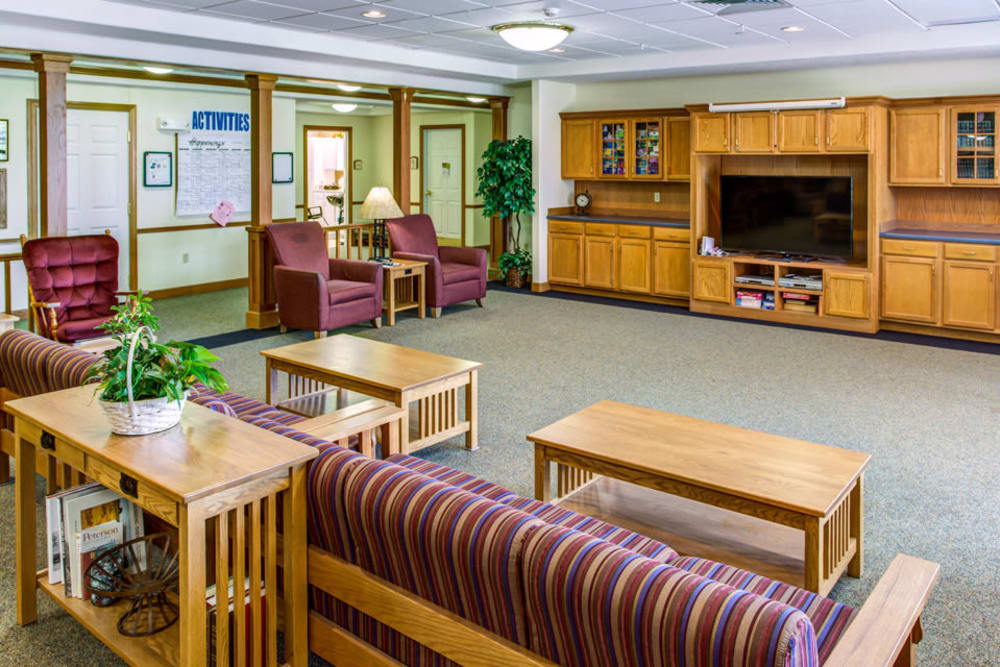 Spacious activity room with big screen TV at Prairie Hills in Independence, Iowa.