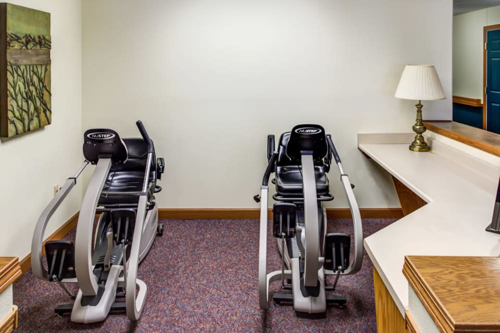 Resident exercise room with equipment at Prairie Hills Independence in Independence, Iowa.