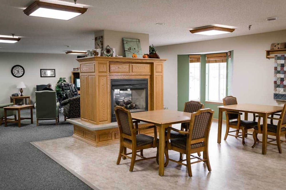 Bright community room with fireplace at Prairie Meadows Senior Living in Kasson, Minnesota. 