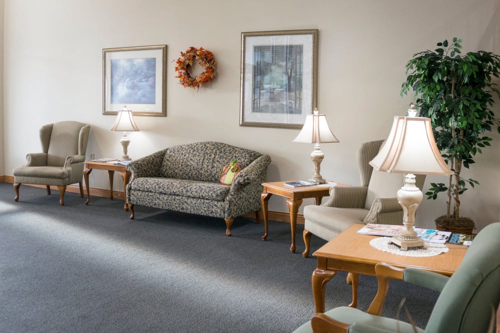 Main lobby with comfortable seating at Prairie Meadows Senior Living in Kasson, Minnesota.