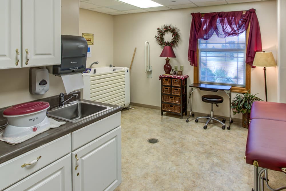 Resident spa with whirlpool tub and massage table at Addington Place of Carroll in Carroll, Iowa.