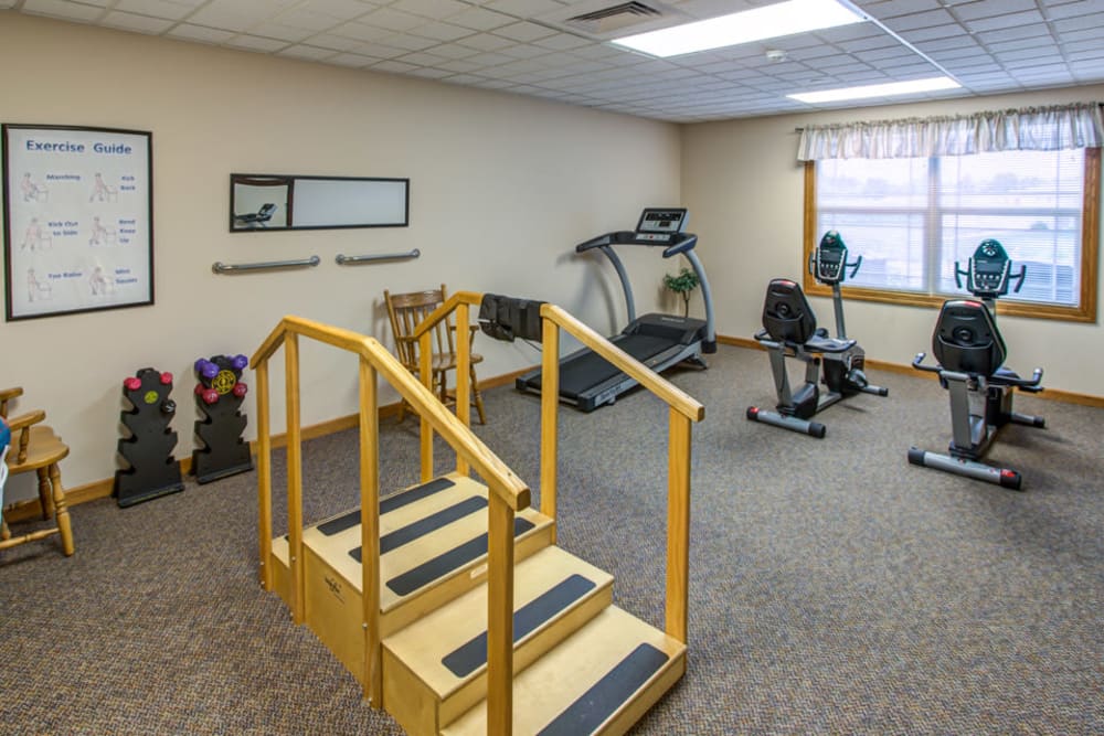Exercise and therapy room with equipment at Addington Place of Carroll in Carroll, Iowa. 