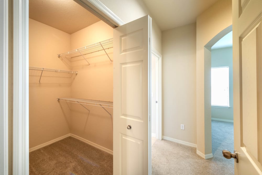Large walk-in closet in a model home at Mirador & Stovall at River City in Jacksonville, Florida