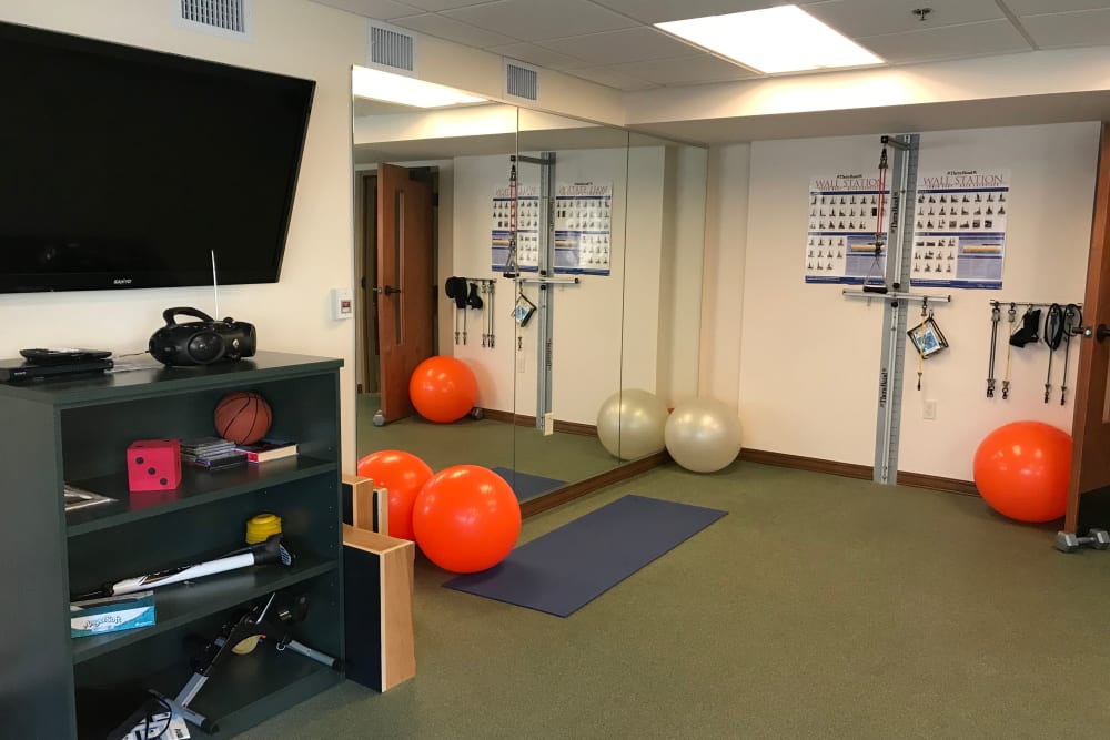 Exercise room with equipment at Prairie Hills Cedar Rapids in Cedar Rapids, Iowa.
