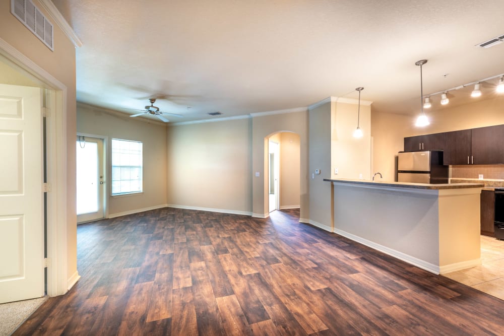 Beautiful hardwood flooring throughout the living areas of a model home at Mirador & Stovall at River City in Jacksonville, Florida