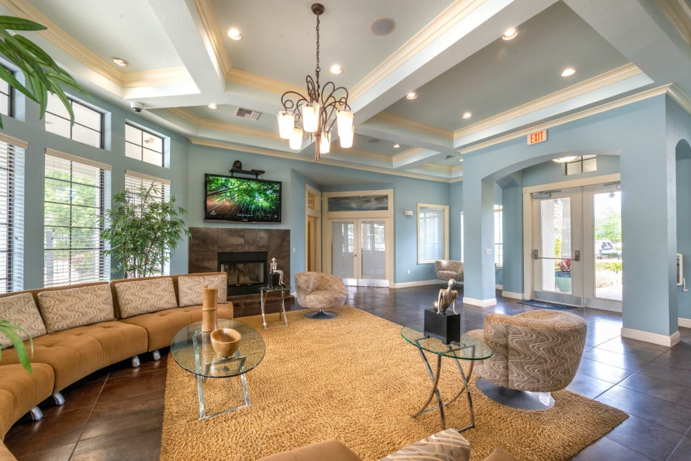 Clubhouse lounge area in front of the fireplace at Mirador & Stovall at River City in Jacksonville, Florida