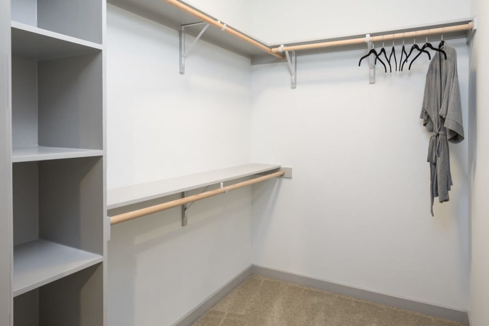 Large walk-in closet in a model apartment at Lux on Main in Carrollton, Texas