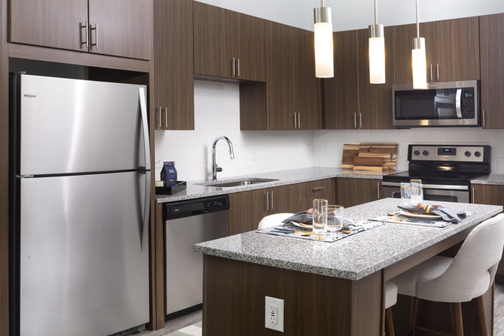 Stainless-steel appliances in a model home's kitchen at Lux on Main in Carrollton, Texas