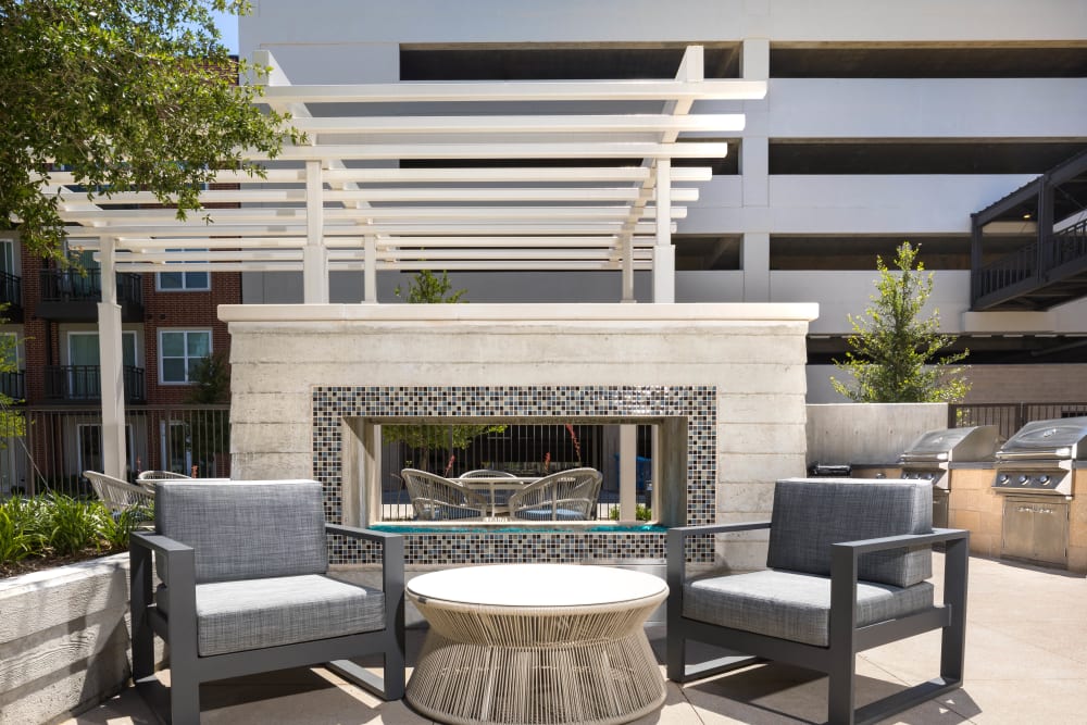 Lounge area in the exterior courtyard at Lux on Main in Carrollton, Texas