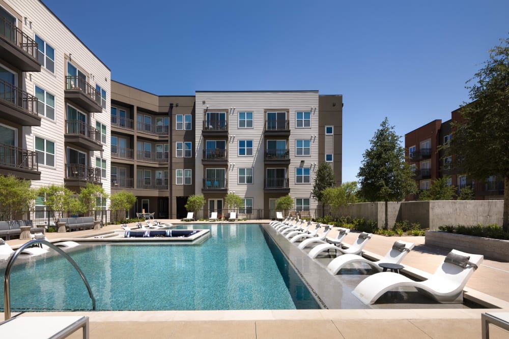 Resort-style swimming pool at Lux on Main in Carrollton, Texas