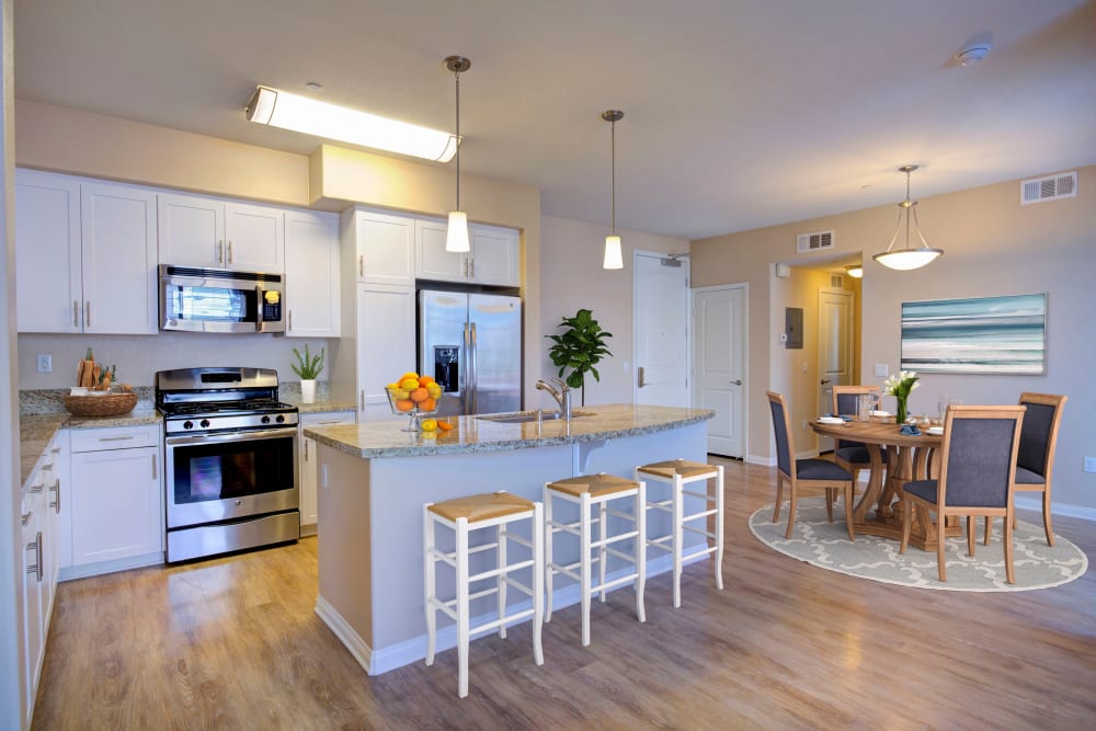 A kitchen, with open floor plan at Palisades Sierra Del Oro in Corona, California