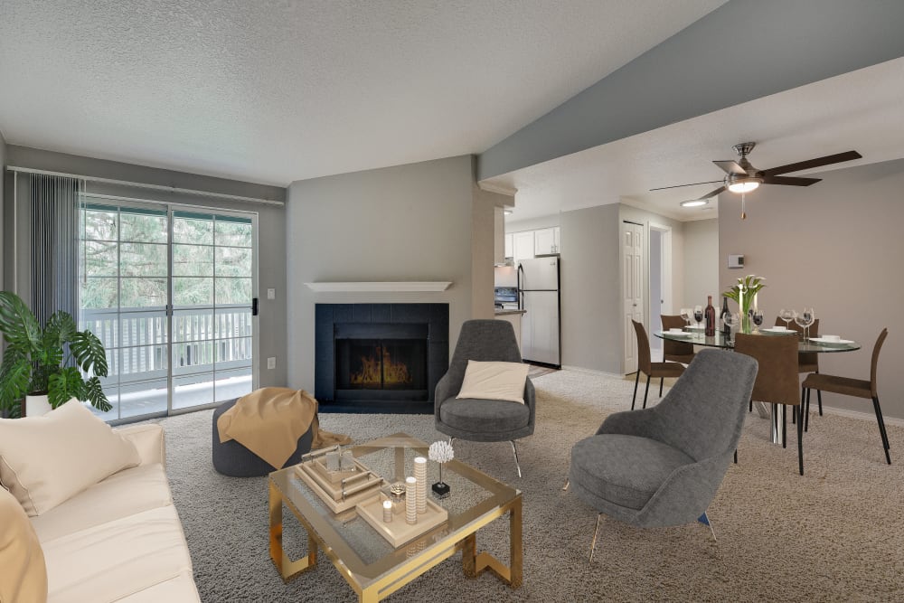 Kitchen and living area view with fireplace, open floorplan at Walnut Grove Landing Apartments in Vancouver, WA